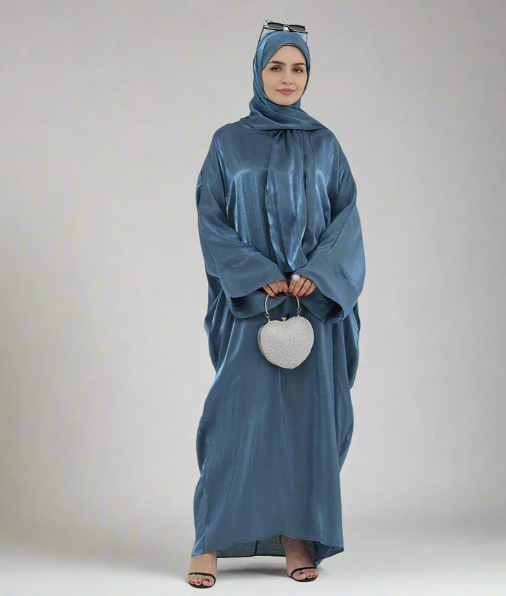 Get trendy with Nessa Shimmer Abaya with Hijab - Teal - Dresses available at Voilee NY. Grab yours for $54.90 today!