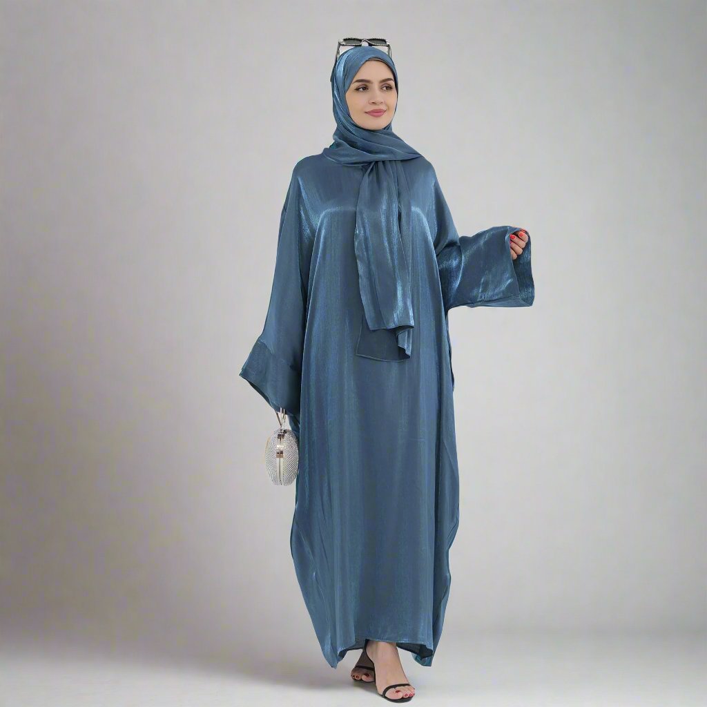 Get trendy with Nessa Shimmer Abaya with Hijab - Teal - Dresses available at Voilee NY. Grab yours for $54.90 today!