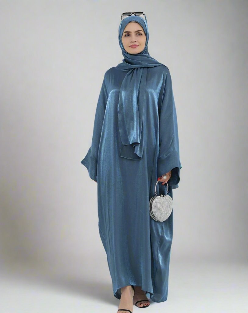 Get trendy with Nessa Shimmer Abaya with Hijab - Teal - Dresses available at Voilee NY. Grab yours for $54.90 today!