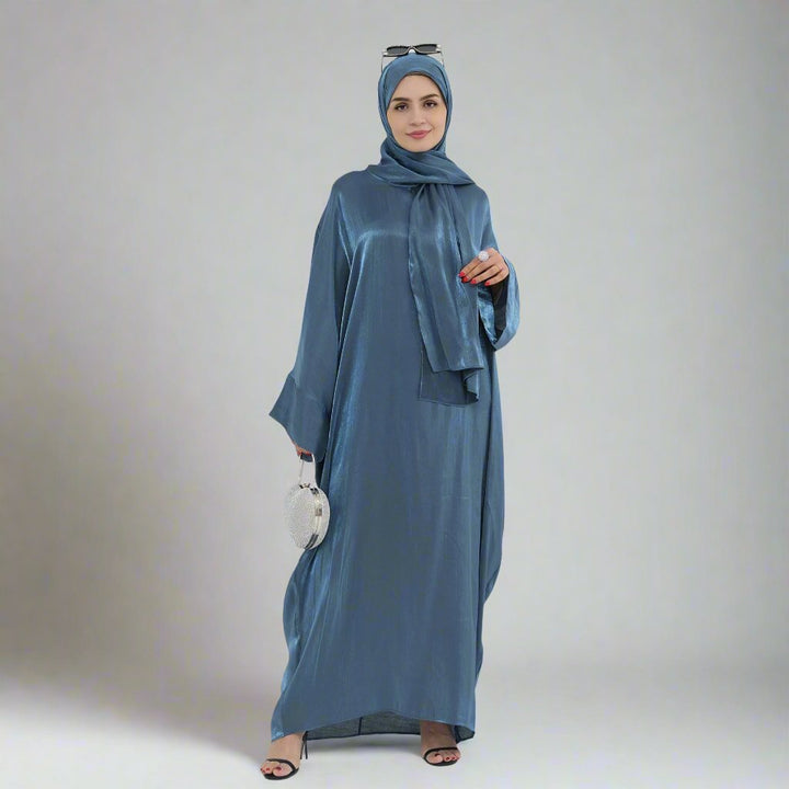 Get trendy with Nessa Shimmer Abaya with Hijab - Teal - Dresses available at Voilee NY. Grab yours for $54.90 today!