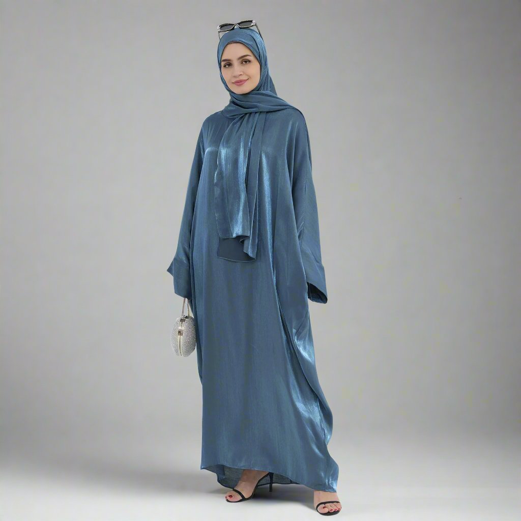 Get trendy with Nessa Shimmer Abaya with Hijab - Teal - Dresses available at Voilee NY. Grab yours for $54.90 today!