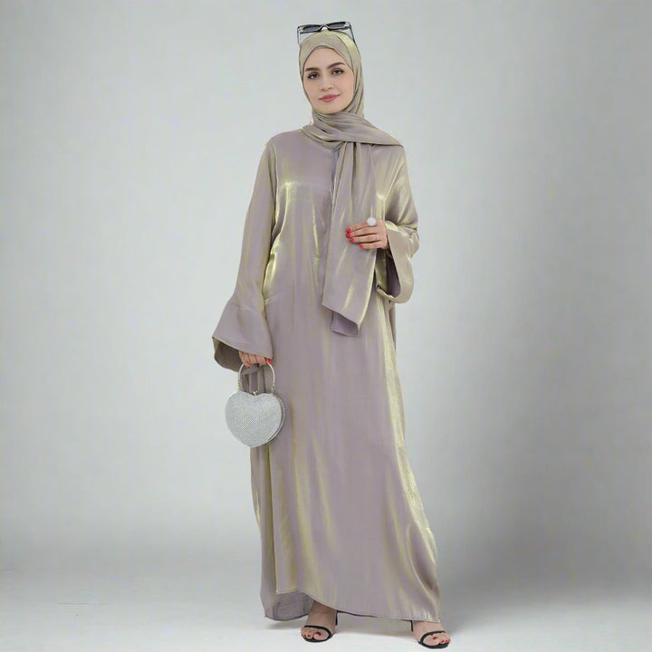 Get trendy with Nessa Shimmer Abaya with Hijab - Beige - Dresses available at Voilee NY. Grab yours for $54.90 today!