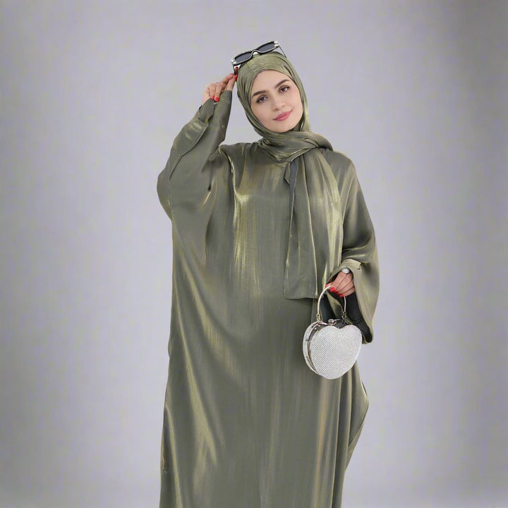 Get trendy with Nessa Shimmer Abaya with Hijab - Olive - Dresses available at Voilee NY. Grab yours for $54.90 today!