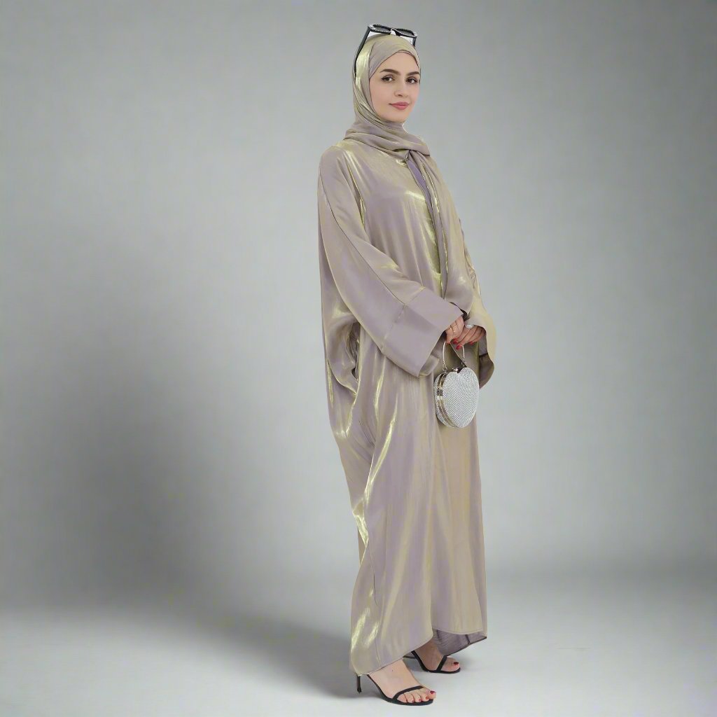 Get trendy with Nessa Shimmer Abaya with Hijab - Beige - Dresses available at Voilee NY. Grab yours for $54.90 today!