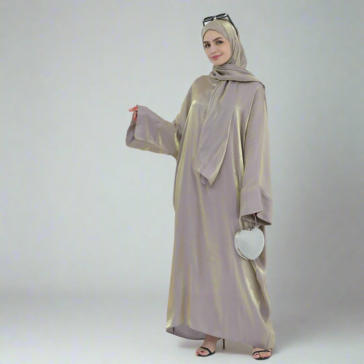 Get trendy with Nessa Shimmer Abaya with Hijab - Beige - Dresses available at Voilee NY. Grab yours for $54.90 today!