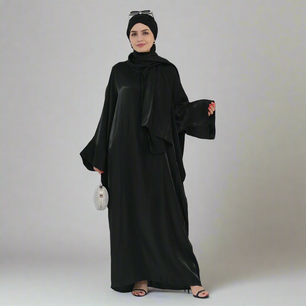 Get trendy with Nessa Shimmer Abaya with Hijab - Black - Dresses available at Voilee NY. Grab yours for $54.90 today!