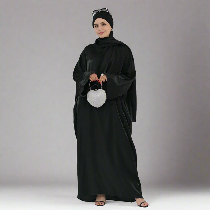 Get trendy with Nessa Shimmer Abaya with Hijab - Black - Dresses available at Voilee NY. Grab yours for $54.90 today!