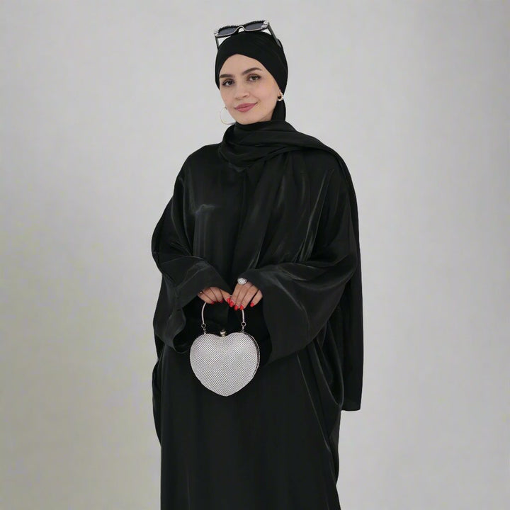 Get trendy with Nessa Shimmer Abaya with Hijab - Black - Dresses available at Voilee NY. Grab yours for $54.90 today!