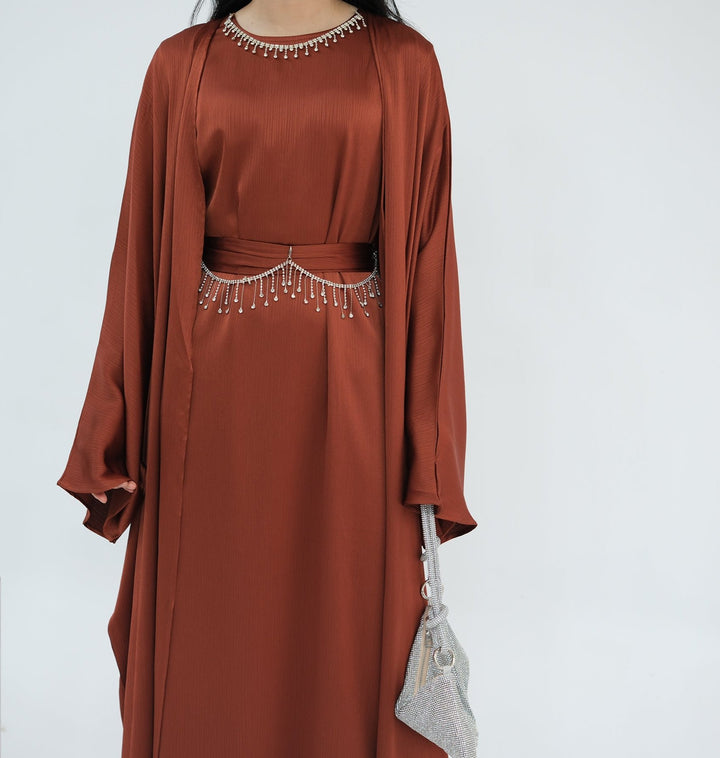 Get trendy with Reina Textured Batwing Abaya Set - Brick -  available at Voilee NY. Grab yours for $109.90 today!