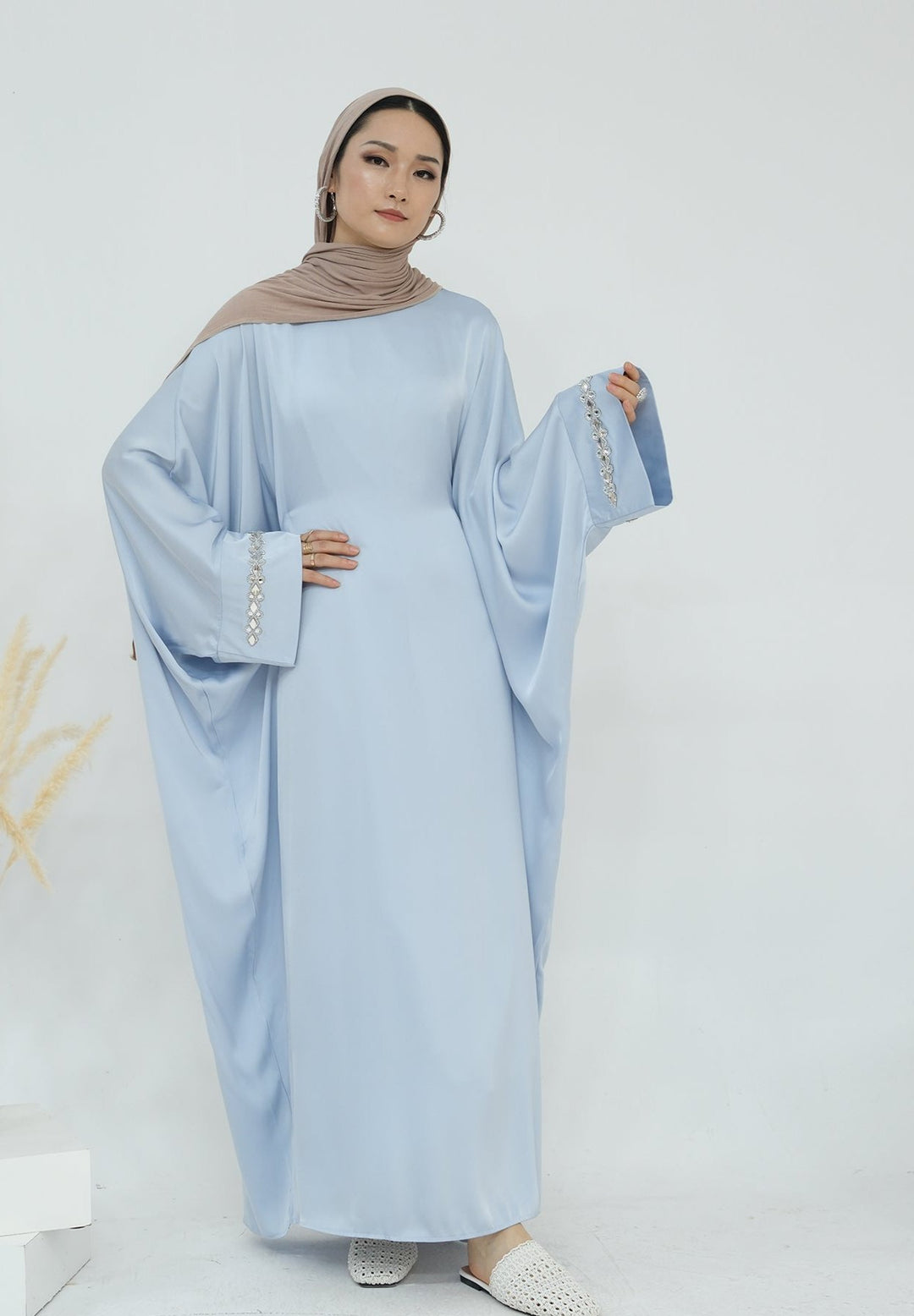 Get trendy with Delisa Butterfly Satin Abaya - Blue -  available at Voilee NY. Grab yours for $74.90 today!