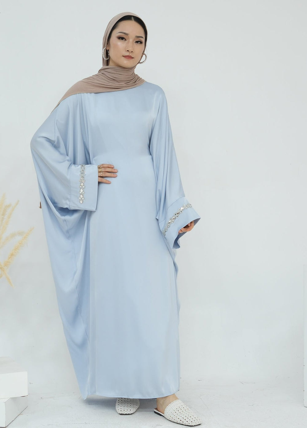 Get trendy with Delisa Butterfly Satin Abaya - Blue -  available at Voilee NY. Grab yours for $74.90 today!