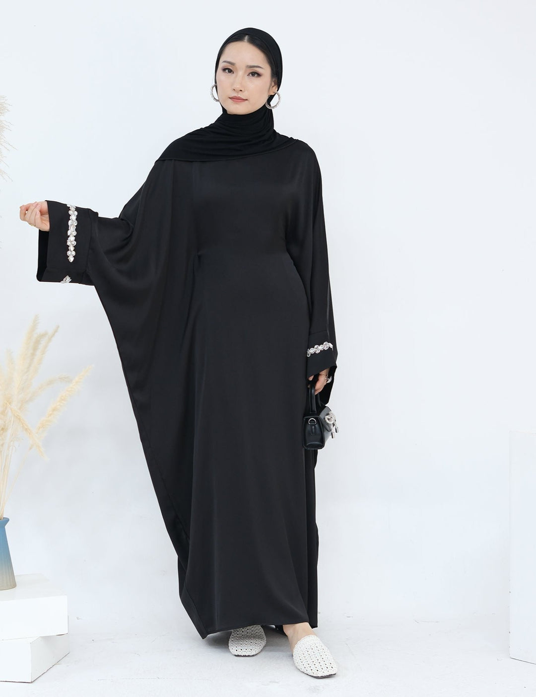 Get trendy with Delisa Butterfly Satin Abaya - Black -  available at Voilee NY. Grab yours for $74.90 today!