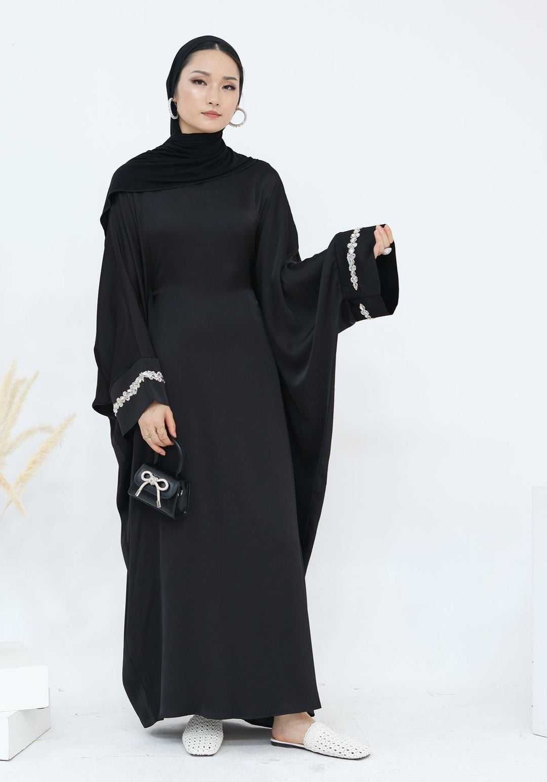 Get trendy with Delisa Butterfly Satin Abaya - Black -  available at Voilee NY. Grab yours for $74.90 today!