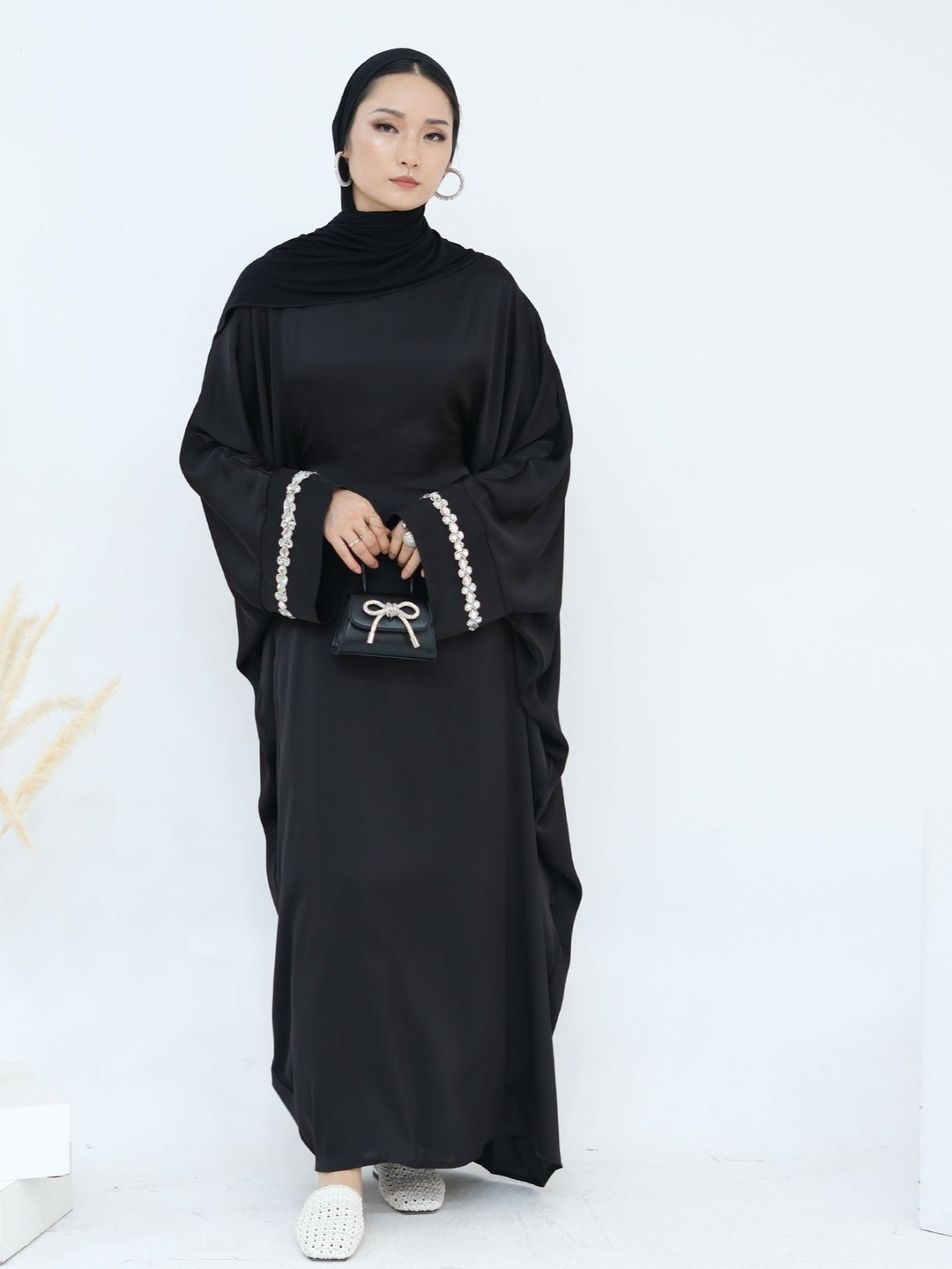 Get trendy with Delisa Butterfly Satin Abaya - Black -  available at Voilee NY. Grab yours for $74.90 today!