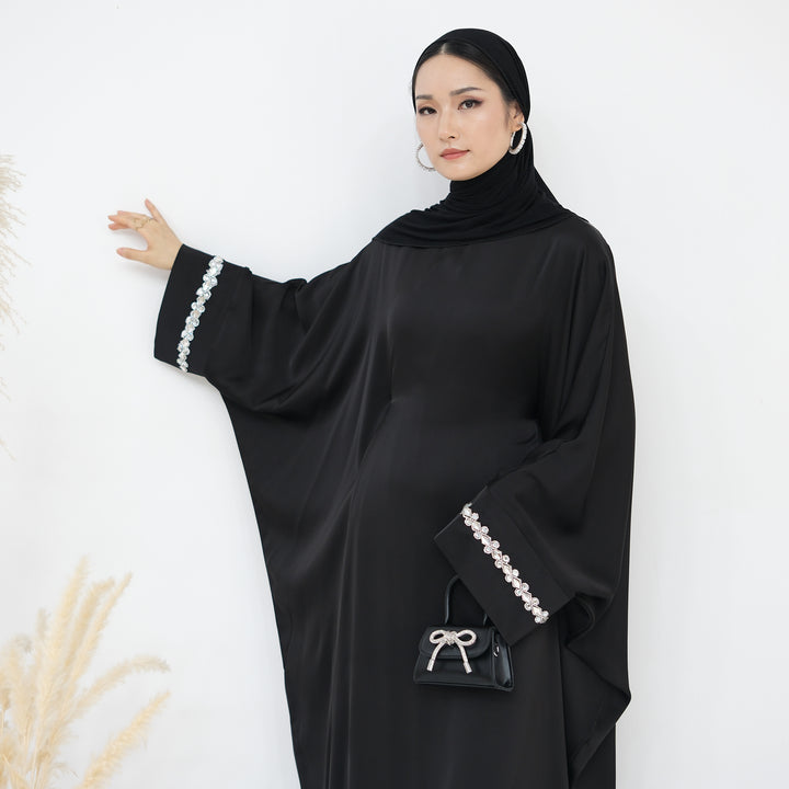 Get trendy with Delisa Butterfly Satin Abaya - Black -  available at Voilee NY. Grab yours for $74.90 today!