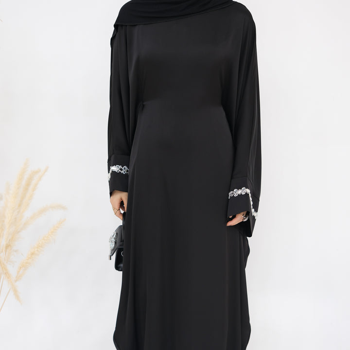 Get trendy with Delisa Butterfly Satin Abaya - Black -  available at Voilee NY. Grab yours for $74.90 today!