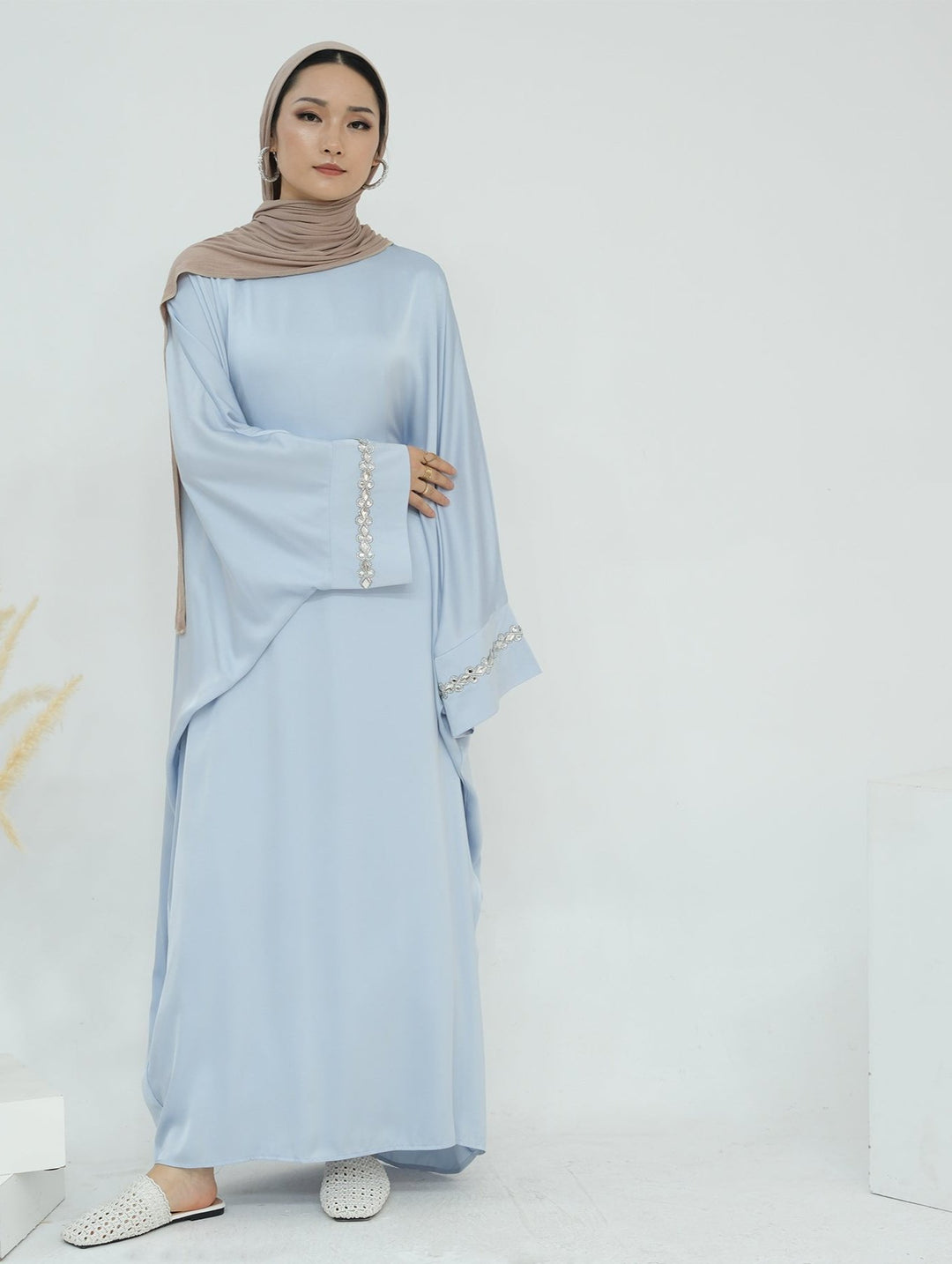 Get trendy with Delisa Butterfly Satin Abaya - Blue -  available at Voilee NY. Grab yours for $74.90 today!