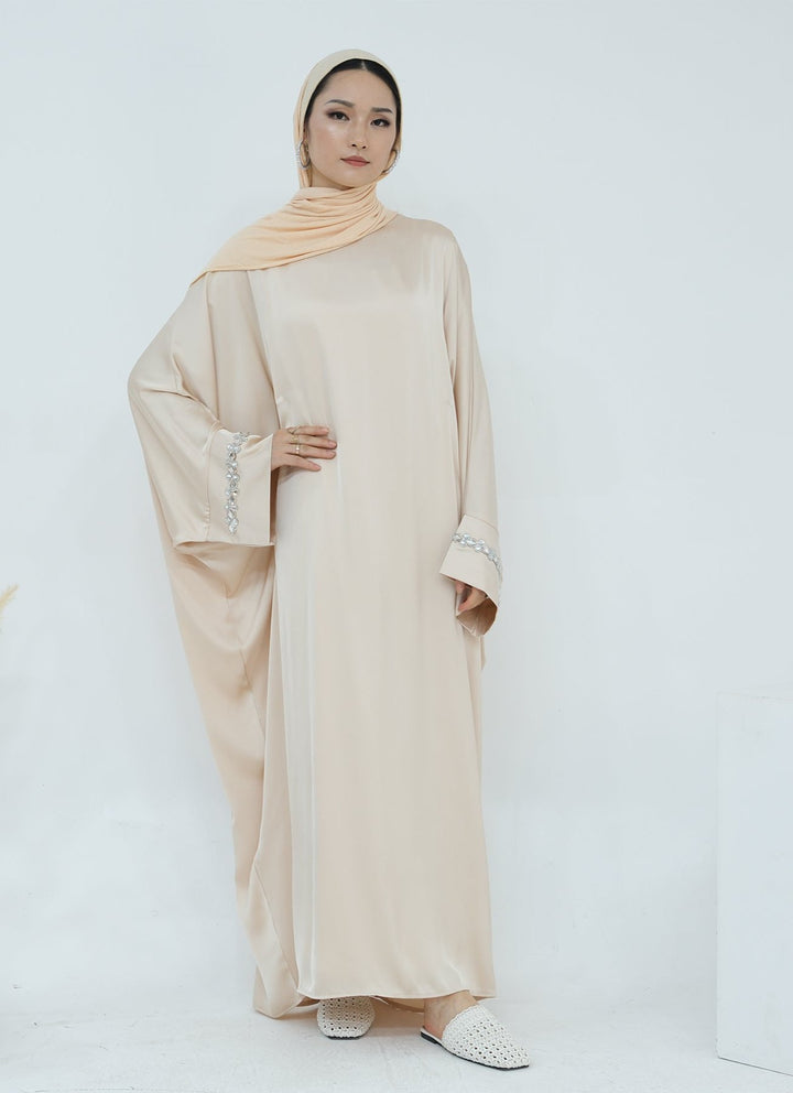 Get trendy with Delisa Butterfly Satin Abaya - Beige -  available at Voilee NY. Grab yours for $74.90 today!