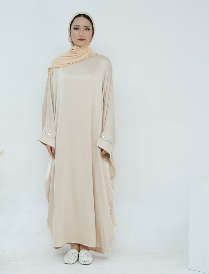 Get trendy with Delisa Butterfly Satin Abaya - Beige -  available at Voilee NY. Grab yours for $74.90 today!