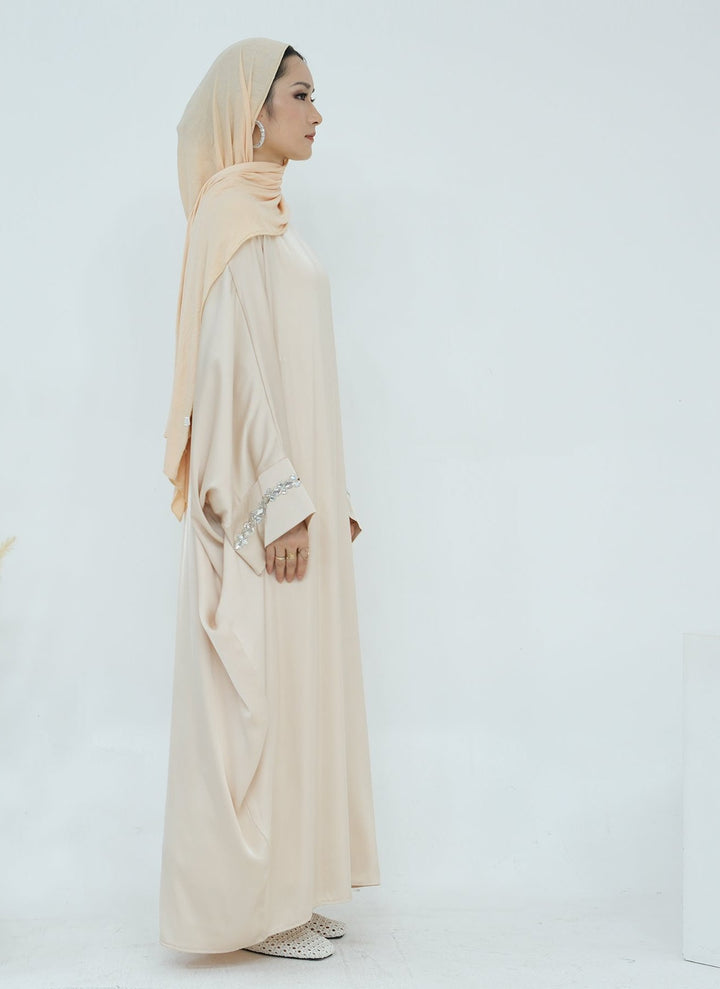 Get trendy with Delisa Butterfly Satin Abaya - Beige -  available at Voilee NY. Grab yours for $74.90 today!