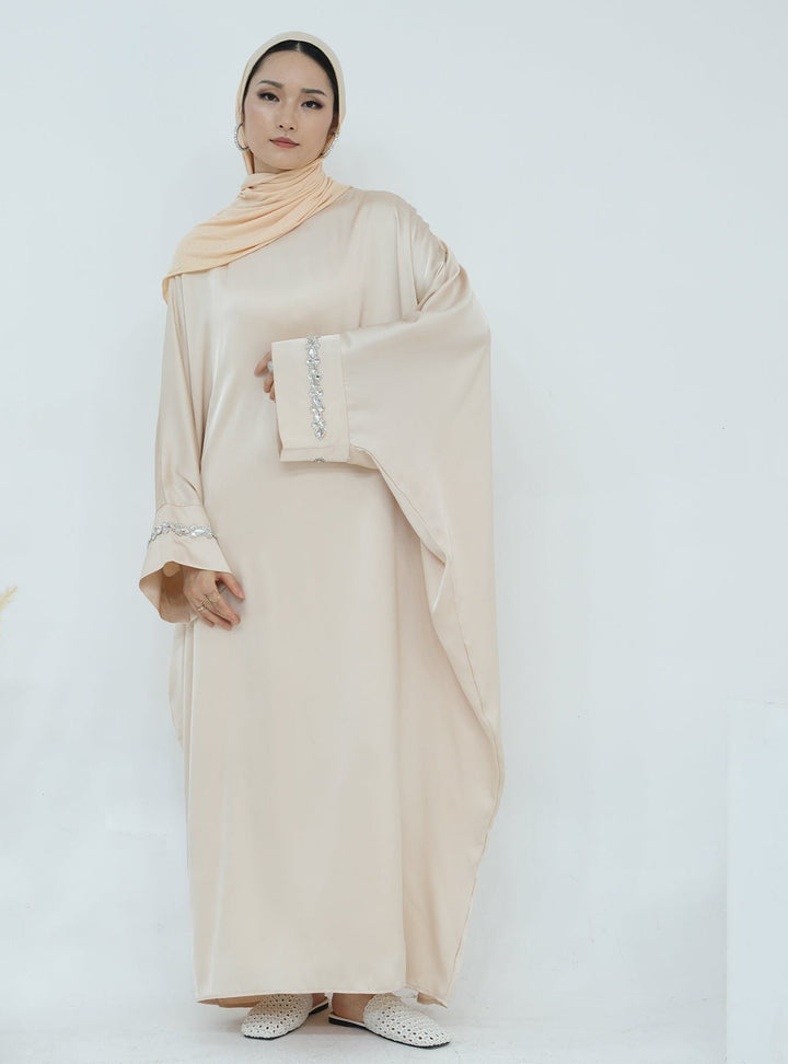 Get trendy with Delisa Butterfly Satin Abaya - Beige -  available at Voilee NY. Grab yours for $74.90 today!