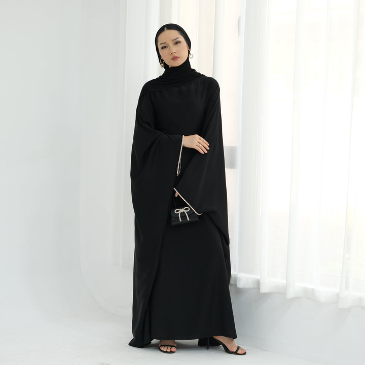 Get trendy with Davina Butterfly Satin Abaya - Black -  available at Voilee NY. Grab yours for $69.90 today!