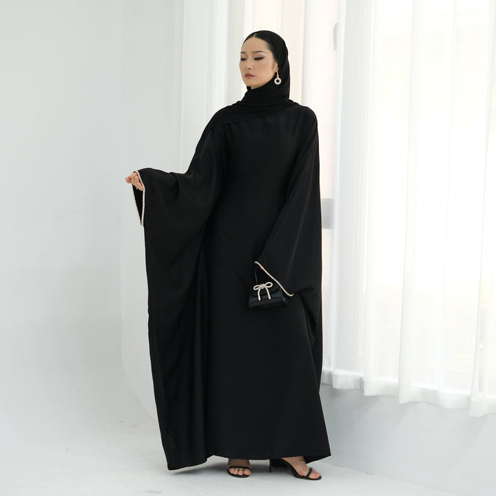 Get trendy with Davina Butterfly Satin Abaya - Black -  available at Voilee NY. Grab yours for $69.90 today!