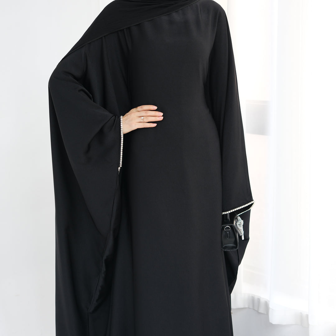 Get trendy with Davina Butterfly Satin Abaya - Black -  available at Voilee NY. Grab yours for $69.90 today!