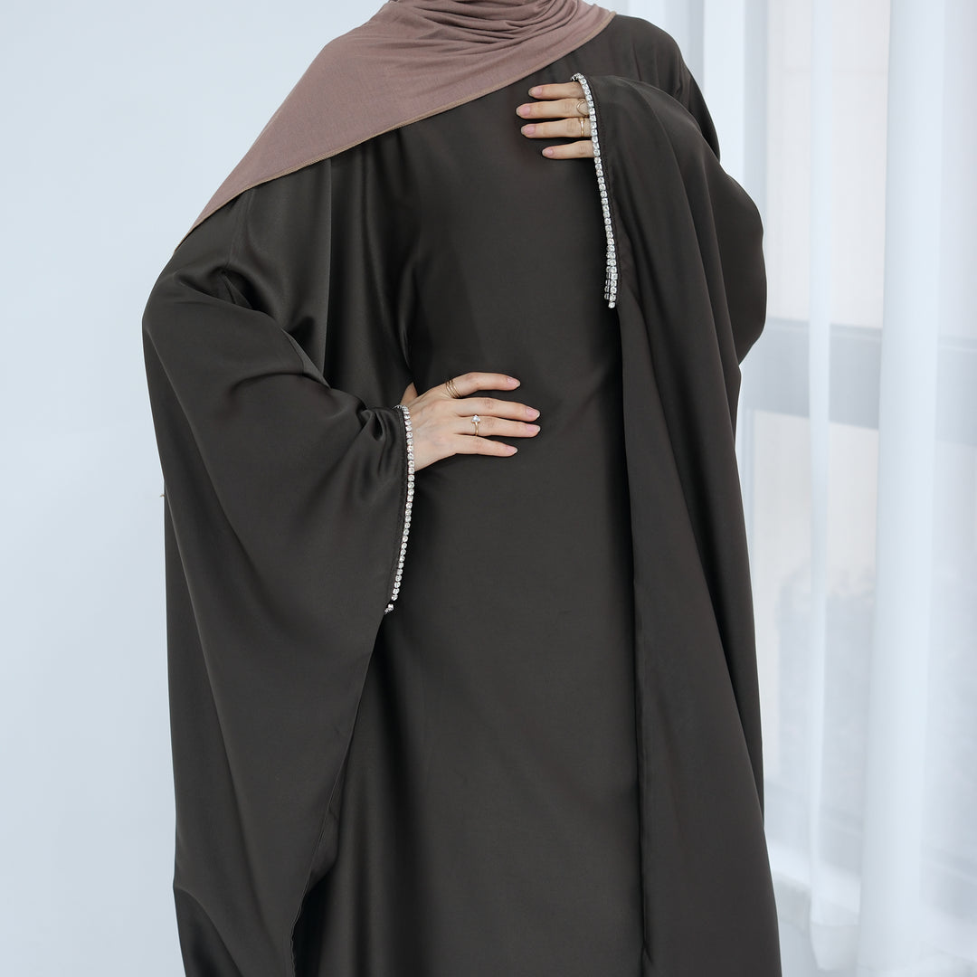 Get trendy with Davina Butterfly Satin Abaya - Coffee -  available at Voilee NY. Grab yours for $69.90 today!