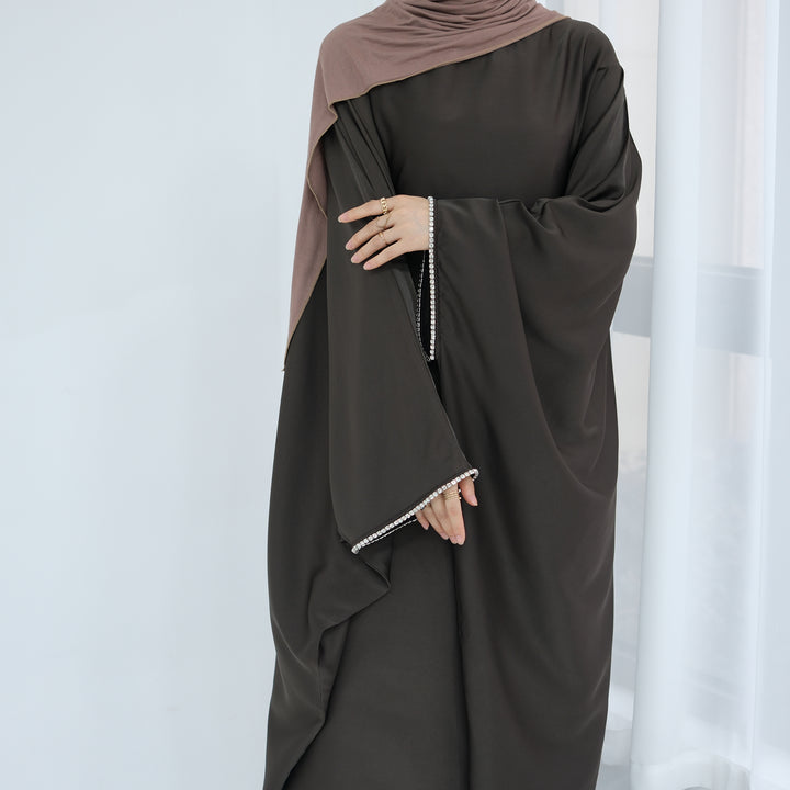 Get trendy with Davina Butterfly Satin Abaya - Coffee -  available at Voilee NY. Grab yours for $69.90 today!