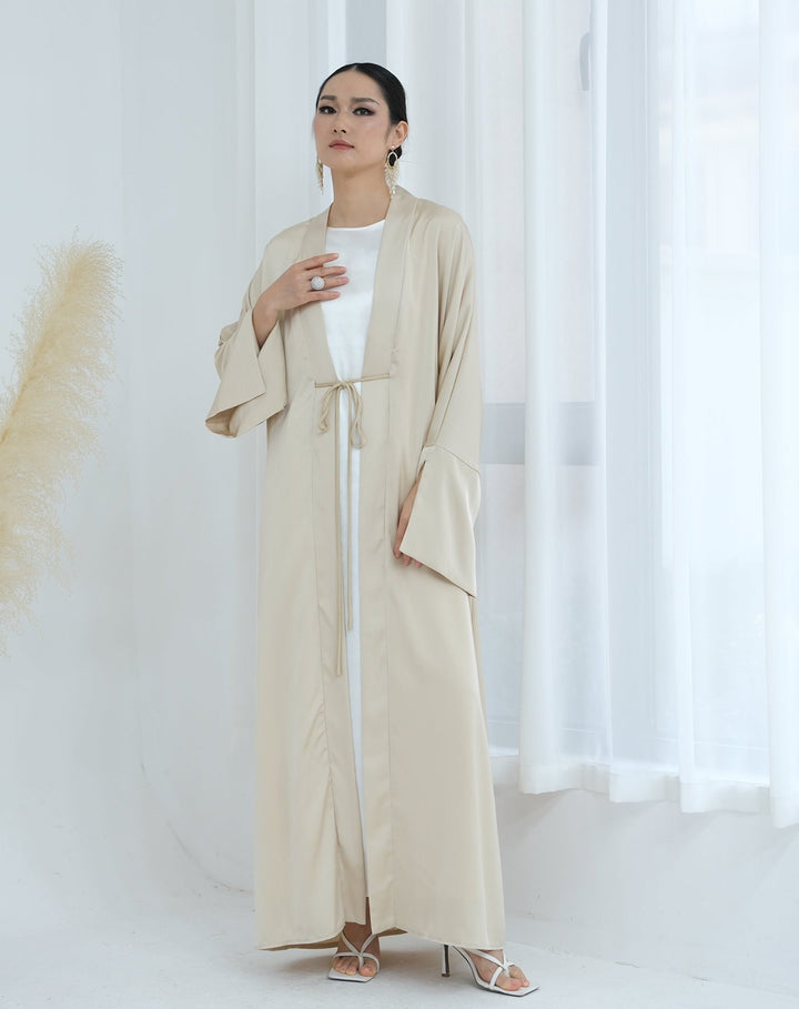 Get trendy with Lavinia Satin Open Abaya - Beige - Cardigan available at Voilee NY. Grab yours for $62.90 today!