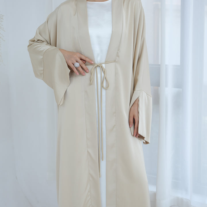 Get trendy with Lavinia Satin Open Abaya - Beige - Cardigan available at Voilee NY. Grab yours for $62.90 today!