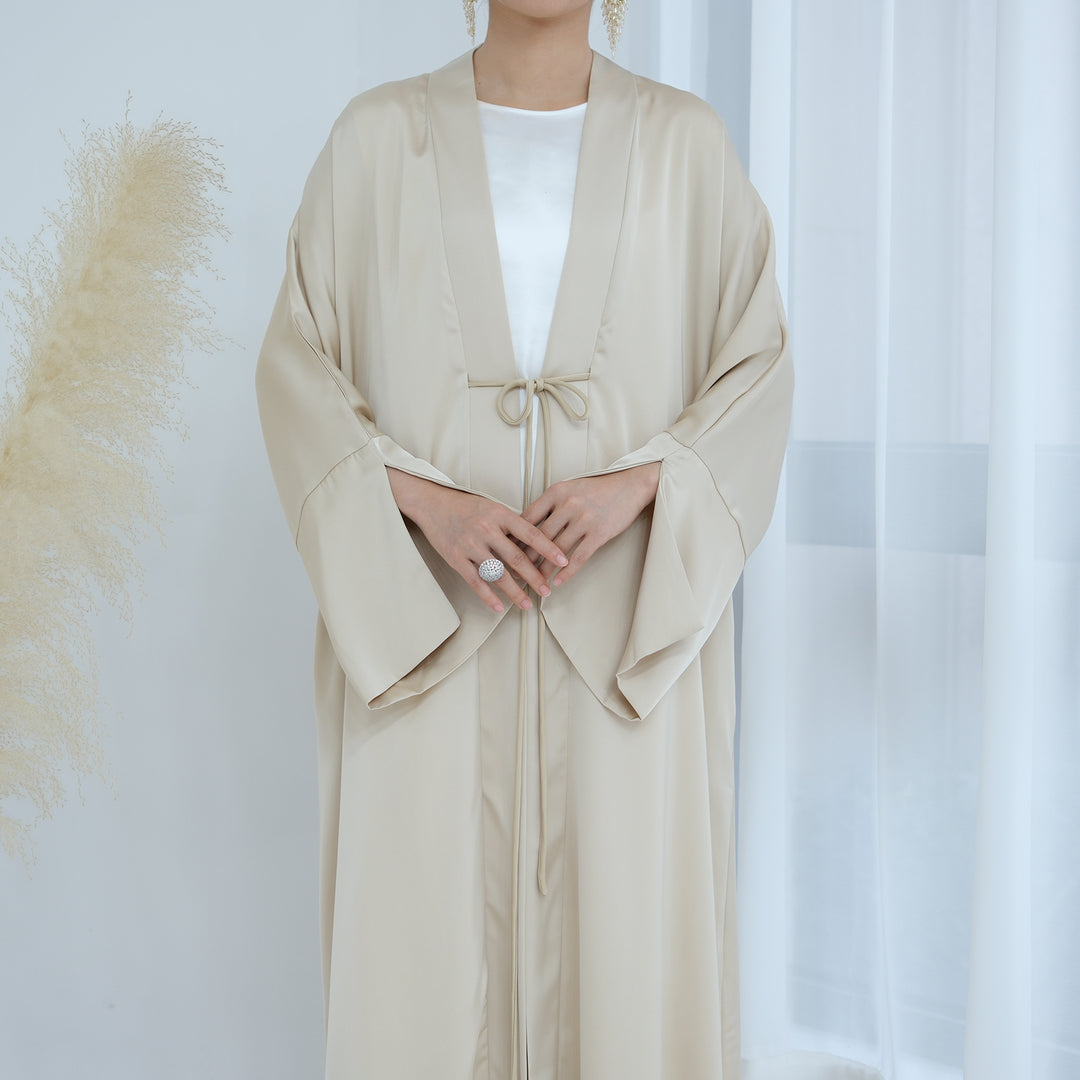 Get trendy with Lavinia Satin Open Abaya - Beige - Cardigan available at Voilee NY. Grab yours for $62.90 today!