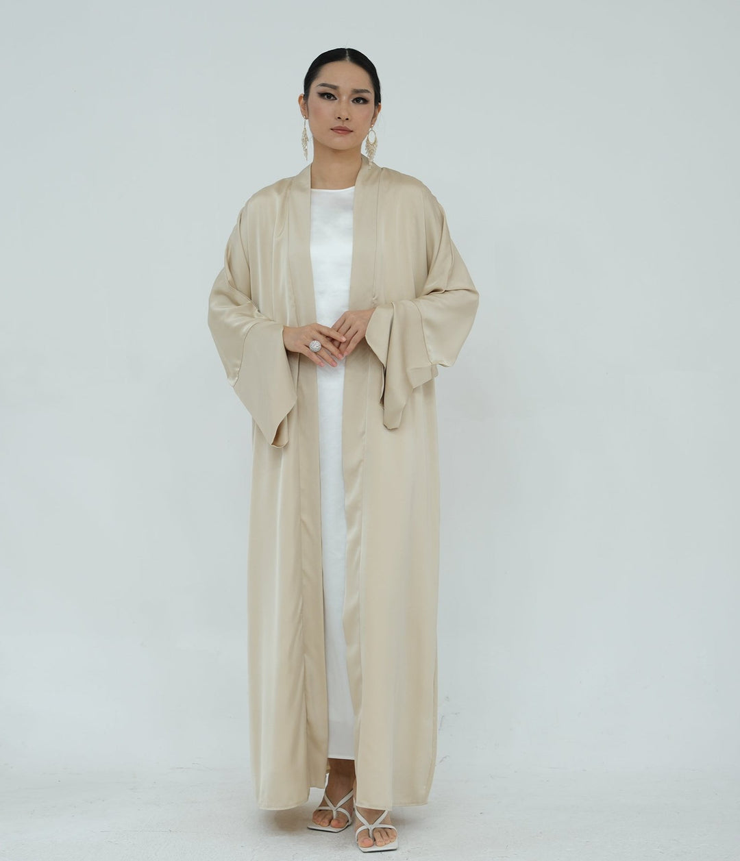 Get trendy with Lavinia Satin Open Abaya - Beige - Cardigan available at Voilee NY. Grab yours for $62.90 today!