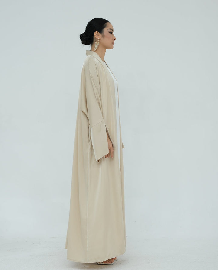 Get trendy with Lavinia Satin Open Abaya - Beige - Cardigan available at Voilee NY. Grab yours for $62.90 today!