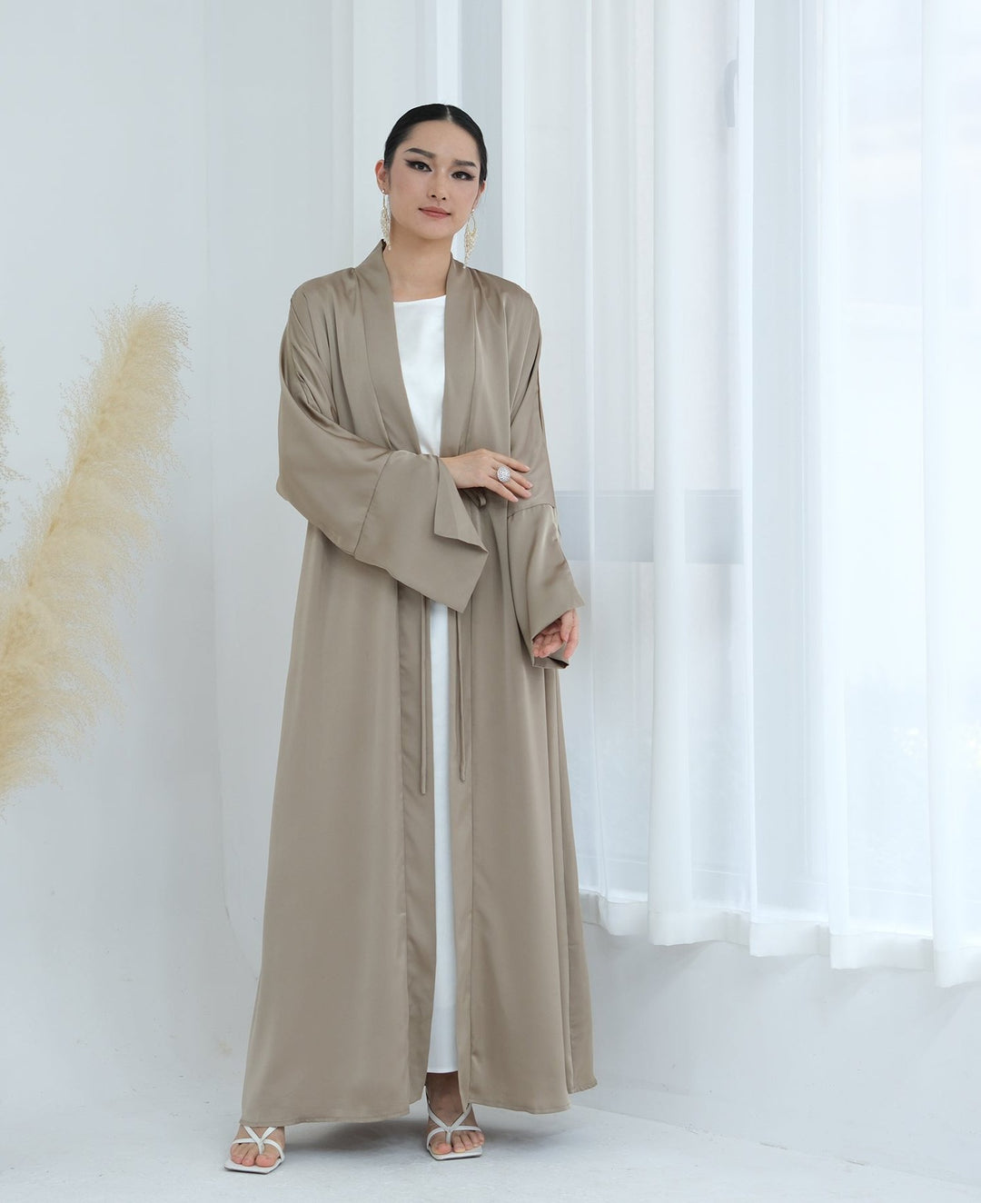 Get trendy with Lavinia Satin Open Abaya - Champagne - Cardigan available at Voilee NY. Grab yours for $62.90 today!