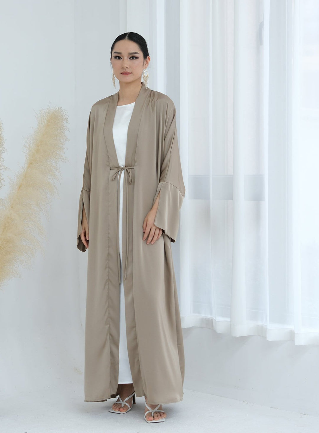 Get trendy with Lavinia Satin Open Abaya - Champagne - Cardigan available at Voilee NY. Grab yours for $62.90 today!