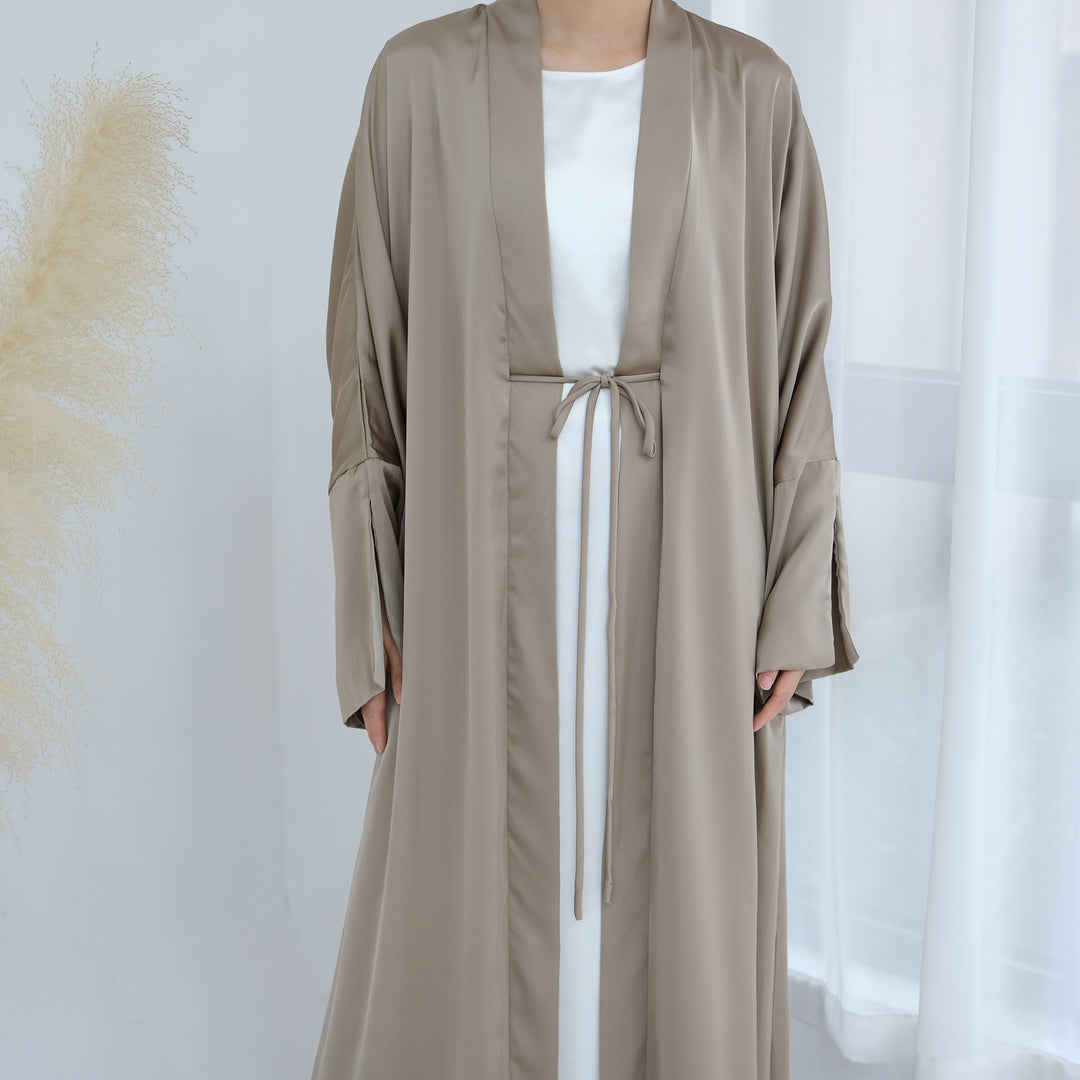 Get trendy with Lavinia Satin Open Abaya - Champagne - Cardigan available at Voilee NY. Grab yours for $62.90 today!