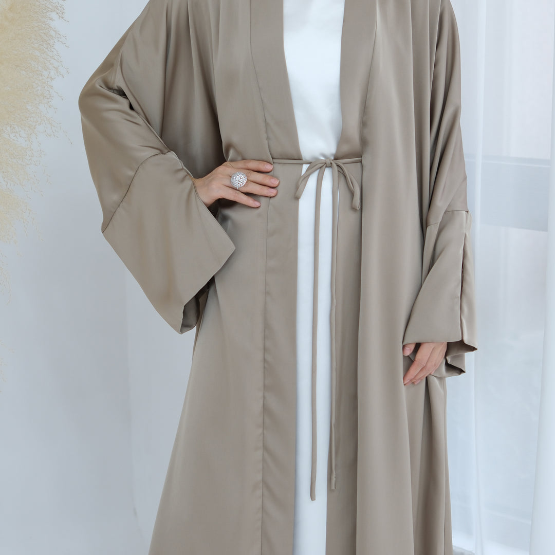 Get trendy with Lavinia Satin Open Abaya - Champagne - Cardigan available at Voilee NY. Grab yours for $62.90 today!