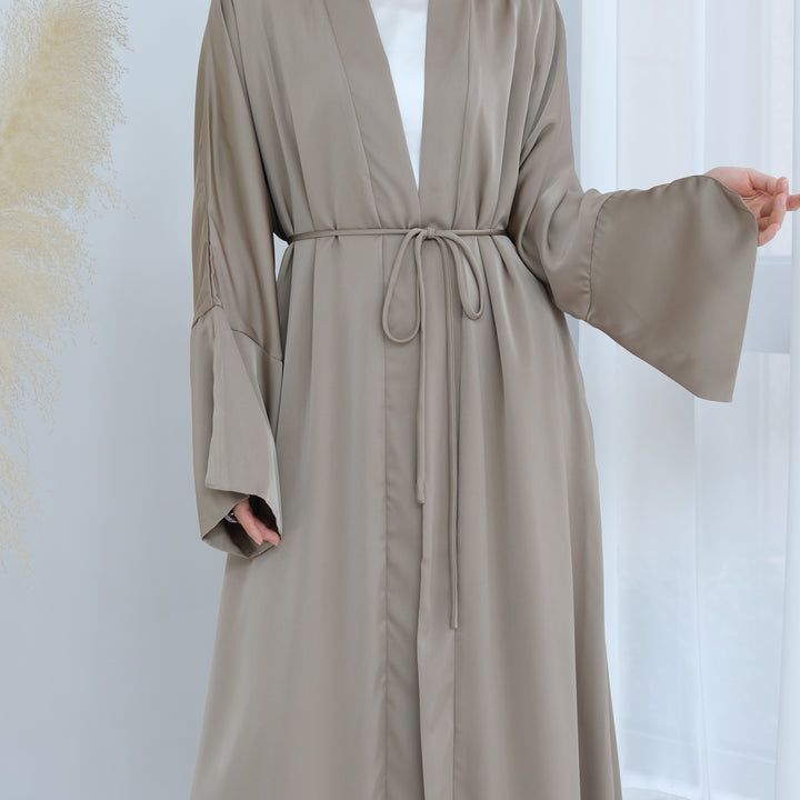 Get trendy with Lavinia Satin Open Abaya - Champagne - Cardigan available at Voilee NY. Grab yours for $62.90 today!