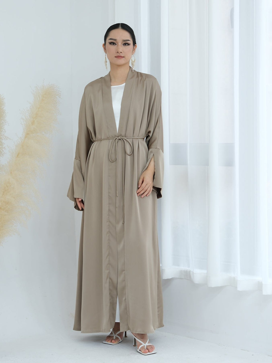 Get trendy with Lavinia Satin Open Abaya - Champagne - Cardigan available at Voilee NY. Grab yours for $62.90 today!