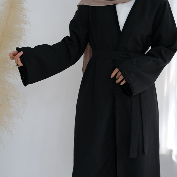 Get trendy with Yara Fringe Belted Duster - Black - Cardigan available at Voilee NY. Grab yours for $59.90 today!