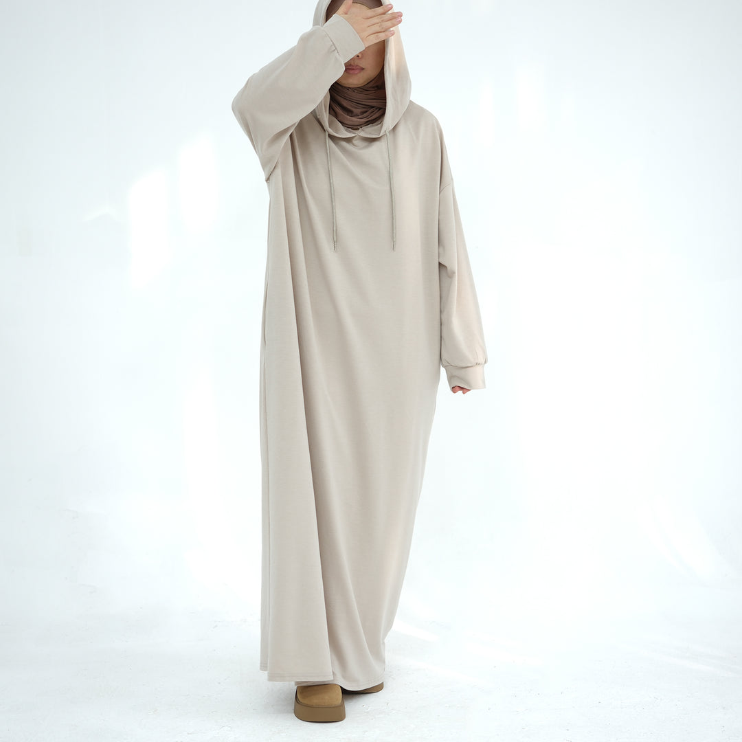 Get trendy with Alora Poly Hoodie Abaya - Sand -  available at Voilee NY. Grab yours for $49.90 today!