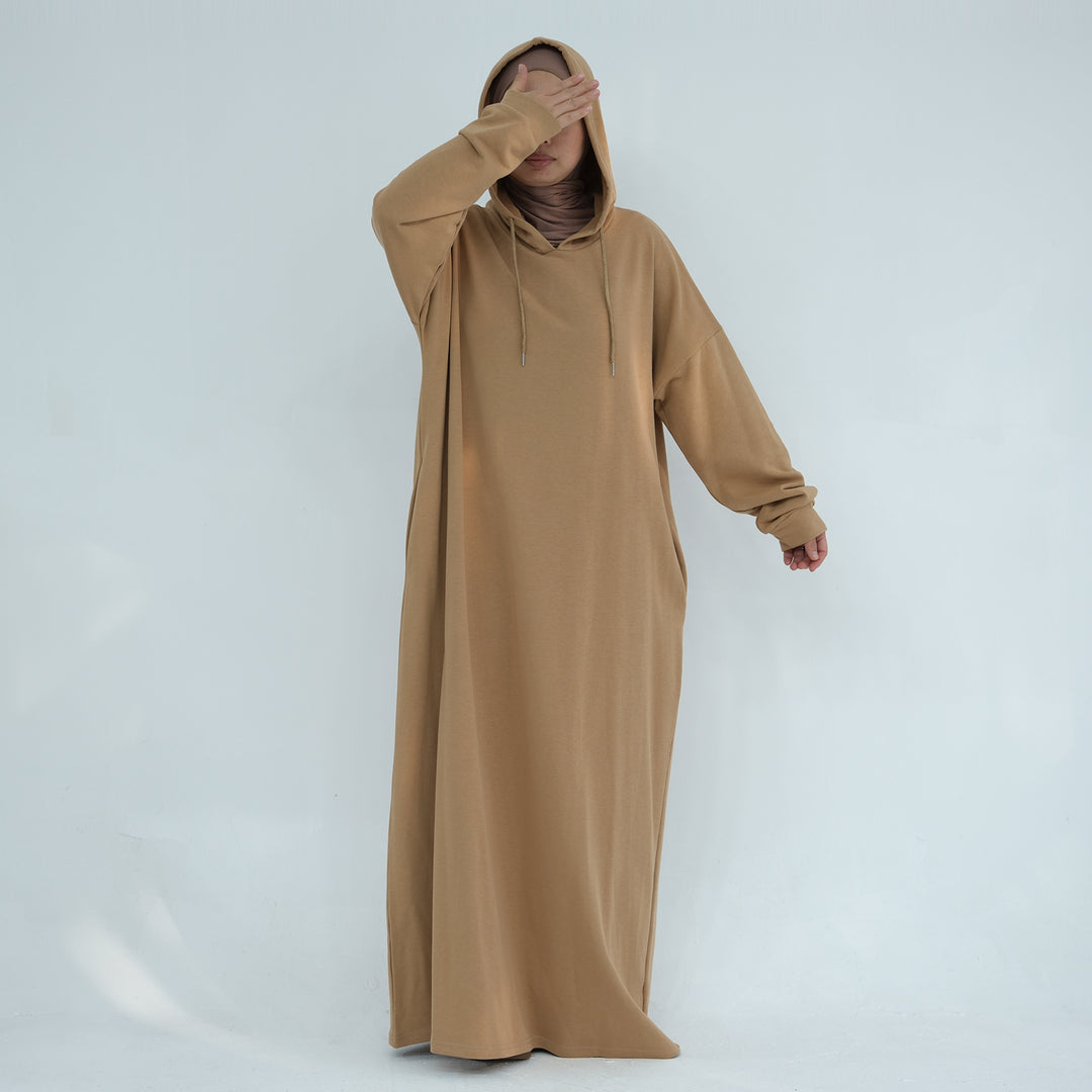 Get trendy with Alora Cotton Hoodie Abaya - Camel -  available at Voilee NY. Grab yours for $59.90 today!