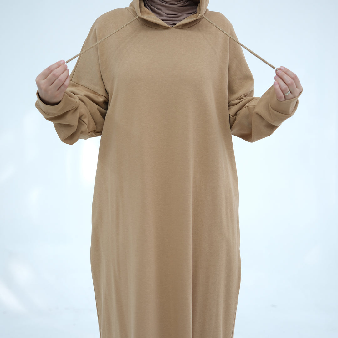 Get trendy with Alora Cotton Hoodie Abaya - Camel -  available at Voilee NY. Grab yours for $59.90 today!