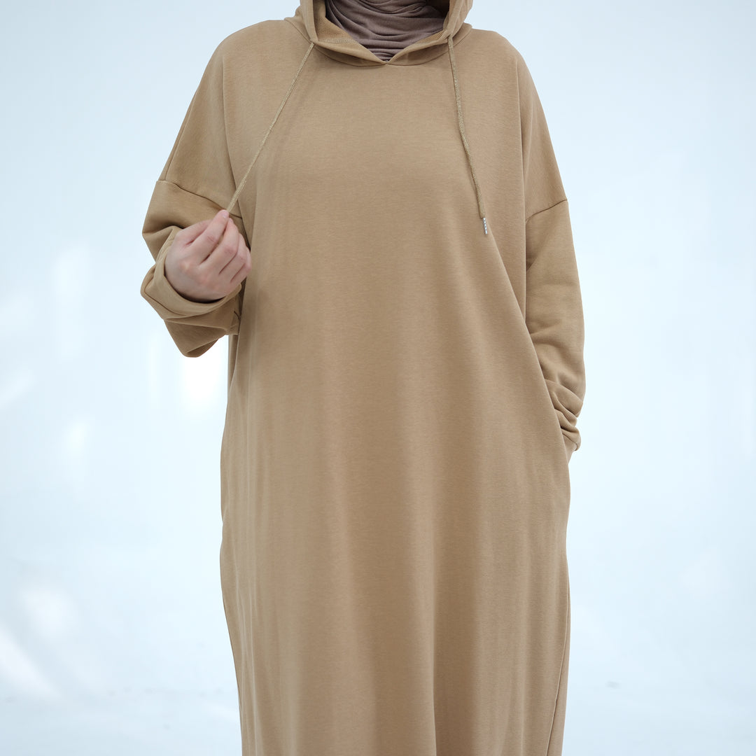 Get trendy with Alora Cotton Hoodie Abaya - Camel -  available at Voilee NY. Grab yours for $59.90 today!