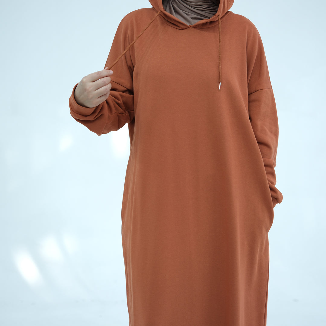 Get trendy with Alora Cotton Hoodie Abaya - Rust -  available at Voilee NY. Grab yours for $59.90 today!