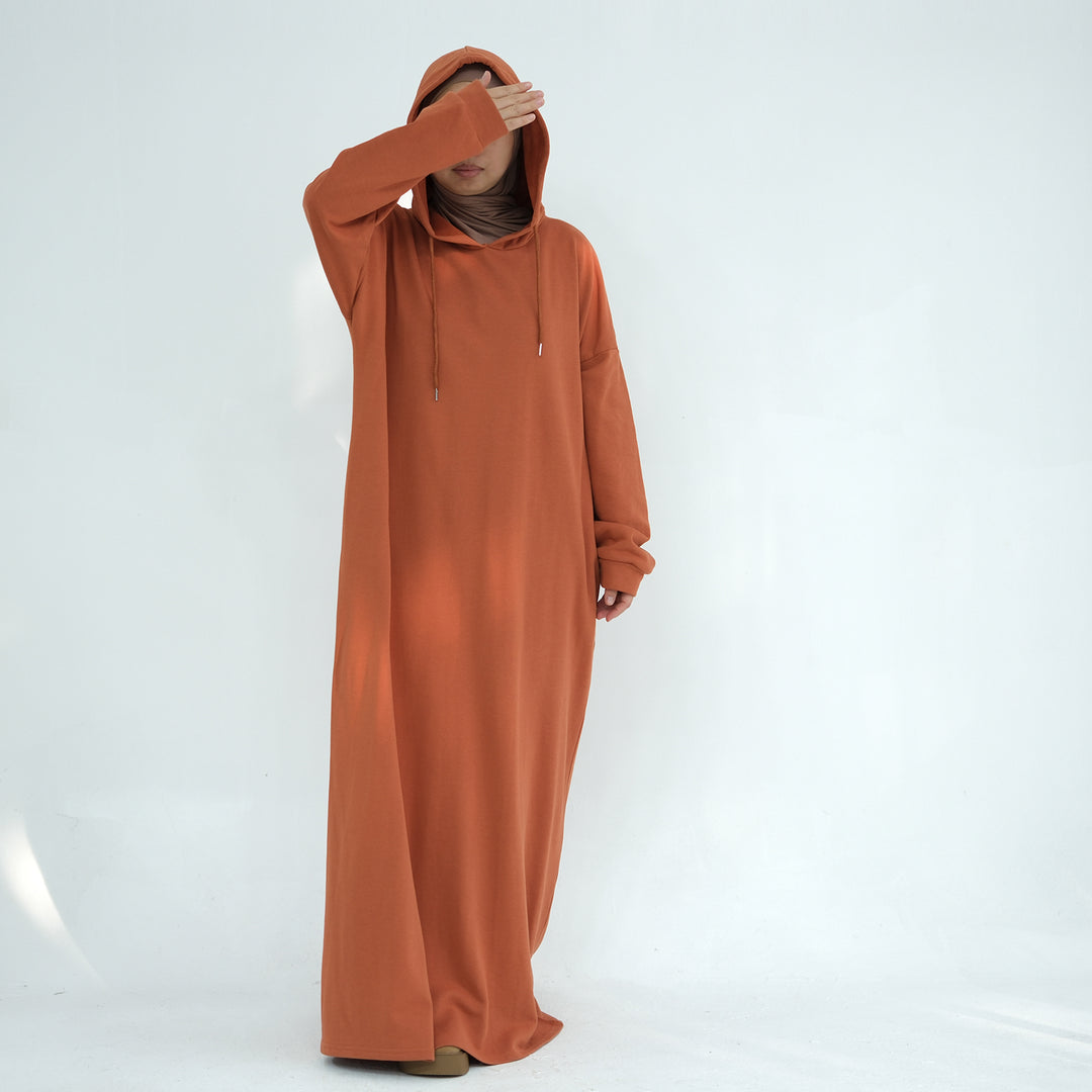 Get trendy with Alora Cotton Hoodie Abaya - Rust -  available at Voilee NY. Grab yours for $59.90 today!