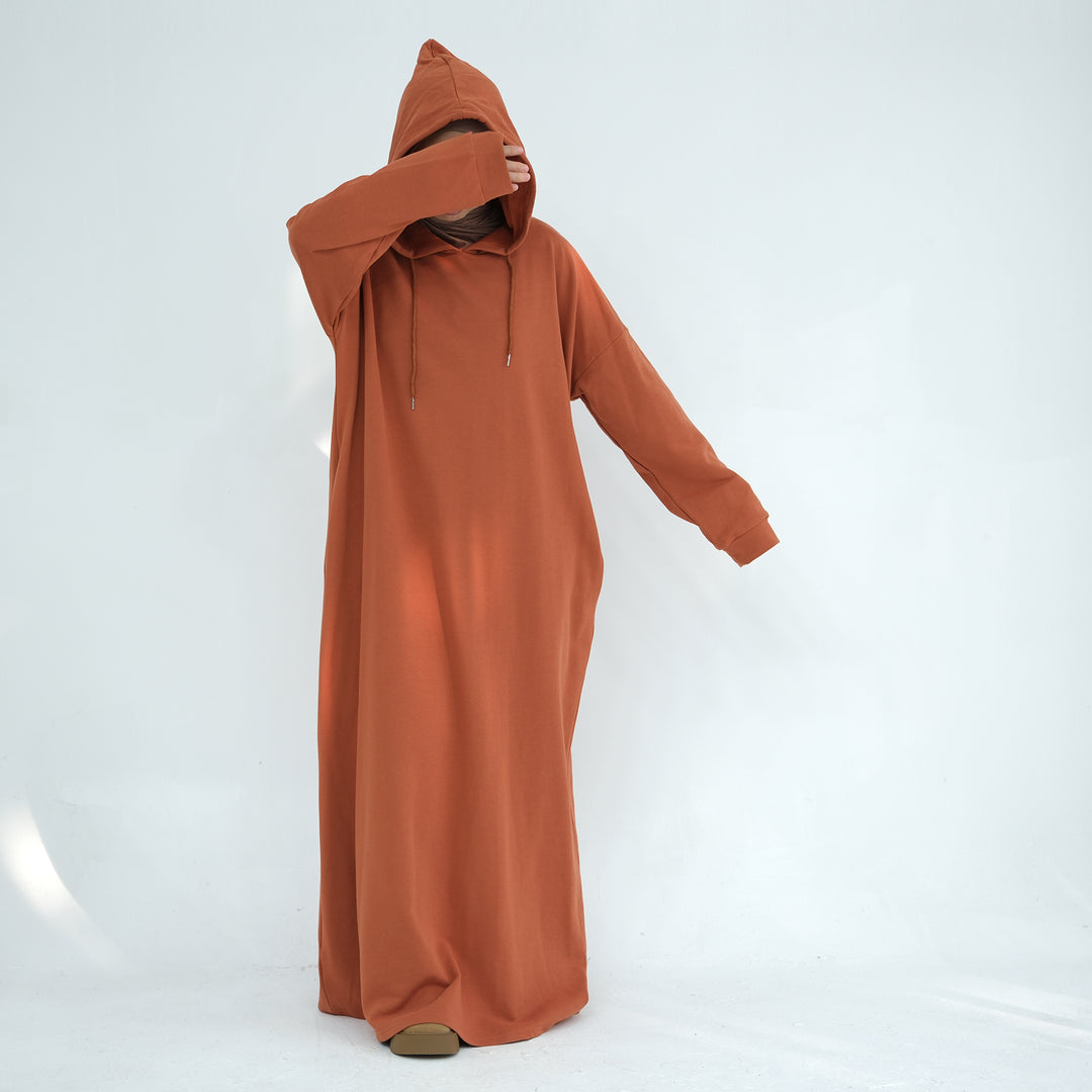 Get trendy with Alora Cotton Hoodie Abaya - Rust -  available at Voilee NY. Grab yours for $59.90 today!