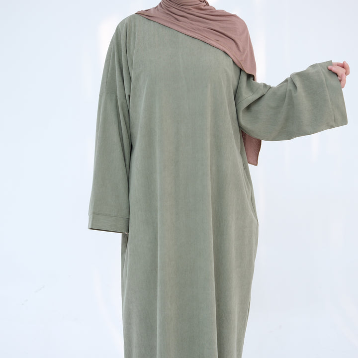 Get trendy with Annan Corduroy Abaya Dress - Sage - Dresses available at Voilee NY. Grab yours for $62.90 today!